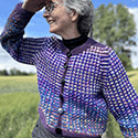 Cropped and low-hip-length crewneck cardigan in interesting stranded mosaic colorwork pattern