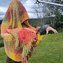 a pullover constructed in a sort of pinwheel fashion in sections so that the front reads as both horizontally and vertically striped