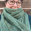 subtly shaded green long scarf in brioche with vertical bands of lace