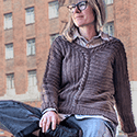 a pullover constructed in a sort of pinwheel fashion in sections so that the front reads as both horizontally and vertically striped