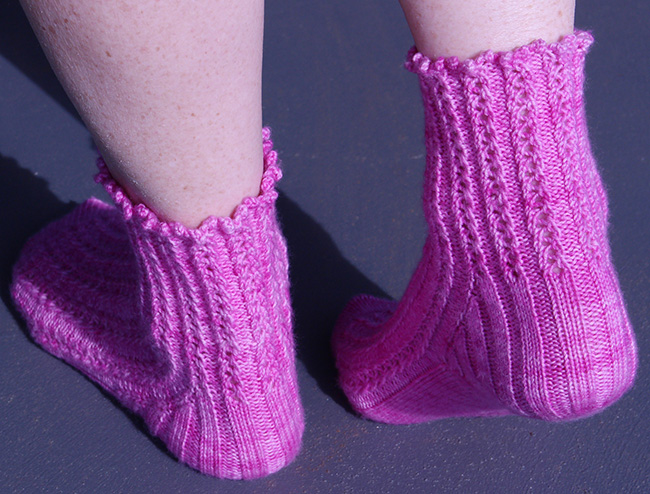 heal view of ripple rib sock pattern in hot pink knitting yarn