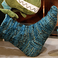 Dinosaur-inspired socks with a unique textured leg