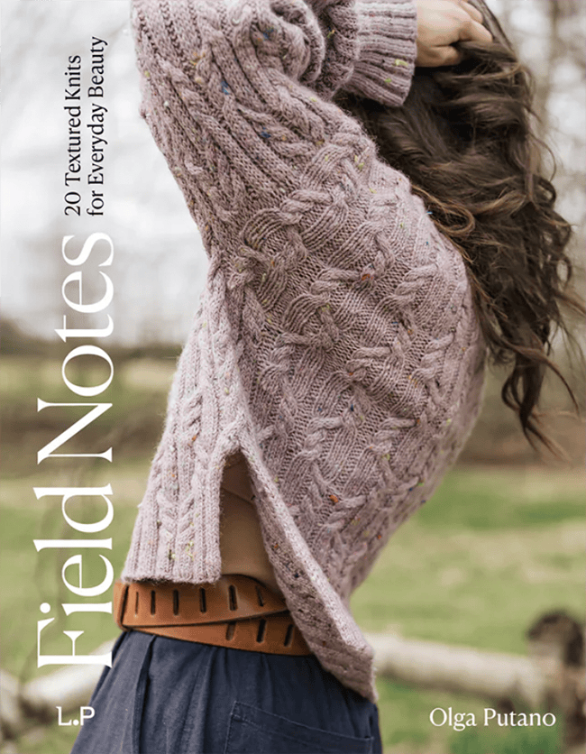 The cover of Field Notes, featuring a pink cabled sweater.