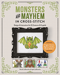 The cover of Monsters and Mayhem in Cross-Stitch featuring a green cross-stitch gargoyle monster in a frame, with 3 blocks below showing a jackalope, a sasquatch, and two gnomes.