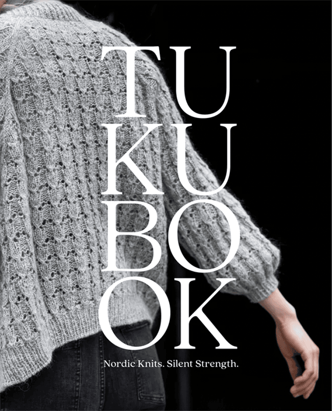 The cover for Tukubook, featuring a top with subtle lace and very small balloon sleeves.
