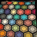 Knitted blanket with hexagonal motifs designed for a selection of miniskeins